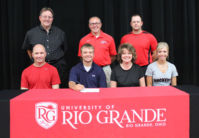 Oak Hill High's Drew Haislop poses with family, coaches and administrators after signing with Rio Grande